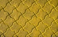 Yellow painted polygonal decorative tiles close