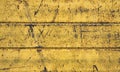 Yellow painted rusty wall with stains