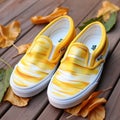 Yellow Painted Slip-on Vans Shoes With Elegant Brushstrokes
