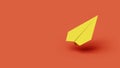 Yellow paper airplane on a red background in the studio Royalty Free Stock Photo