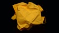 Yellow paper crushed by hand squeeze, for wallpaper, added text Royalty Free Stock Photo