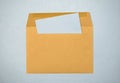 Yellow paper envelope on a blue background