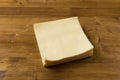 Yellow paper napkin on wooden background Royalty Free Stock Photo