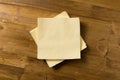 Yellow paper napkin on wooden background Royalty Free Stock Photo