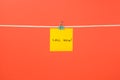 Yellow paper note on clothesline with text Call Now! Royalty Free Stock Photo