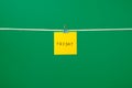 Yellow paper note on clothesline with text Friday Royalty Free Stock Photo