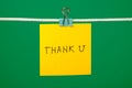 Yellow paper note on clothesline with text Thank U Royalty Free Stock Photo