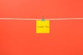 Yellow paper note on clothesline with text Thank You