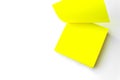 Yellow paper note. Yellow reminder note Against White Background. Close-Up. Blank yellow sticky note Royalty Free Stock Photo