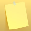 Yellow paper sheet attached by scotch tape to the wall Royalty Free Stock Photo