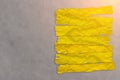 yellow paper tag on grey leather background Royalty Free Stock Photo