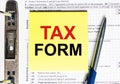 Yellow paper with text Tax Form