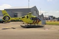 Yellow paramedic trauma support helicopter PH-DOC on Rotterdam The Hague airport