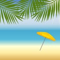 Yellow parasol at the beach under palm trees Royalty Free Stock Photo