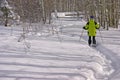 Yellow parka snow shoe hiker, Royalty Free Stock Photo