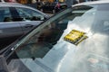 Yellow Parking Charge Notice on a windshield of a car which has not paid for the parking in Glasgow Royalty Free Stock Photo