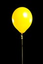 Yellow Party balloon on black Royalty Free Stock Photo