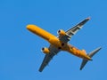 Yellow passenger jet Embraer ERJ-195SR