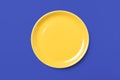 Yellow pastel plate on complementary blue background