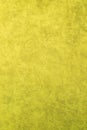 Yellow patterned surface of velvet fabric on top. Texture of artificial cloth