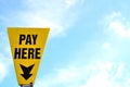 Yellow pay here car park sign Royalty Free Stock Photo