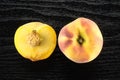 Yellow peach on black wood Royalty Free Stock Photo
