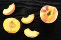Yellow peach on black wood Royalty Free Stock Photo