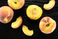 Yellow peach on black wood Royalty Free Stock Photo