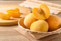 Yellow peaches in a bamboo basket