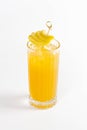 Yellow pear cocktail in a deep glass decorated with a pear and ice Royalty Free Stock Photo
