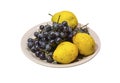 Yellow pear and grapes on the plate Royalty Free Stock Photo