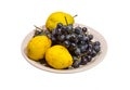Yellow pear and grapes on the plate Royalty Free Stock Photo
