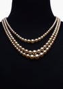 Yellow pearl necklace on black mannequin isolated Royalty Free Stock Photo