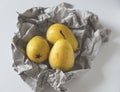Yellow pears in paper Royalty Free Stock Photo
