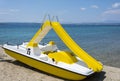 Yellow pedal boat on a beach Royalty Free Stock Photo