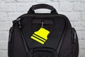 Yellow pedestrain safety reflector on a black backpack,. Concept Royalty Free Stock Photo
