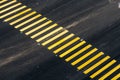 Yellow pedestrian crossing on black asphalt, diagonal Royalty Free Stock Photo