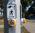 Yellow pedestrian crossing button on a pole Royalty Free Stock Photo