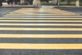Yellow pedestrian crossing the road