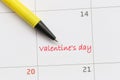 Yellow pen pointing to the letter number 14 of valentine`s day