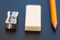 Yellow pencil, metal sharpener and rubber Royalty Free Stock Photo