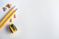 The Yellow pencil with shaving on white drawing watercolor paper Royalty Free Stock Photo
