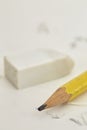 Yellow pencil White eraser and eraser leftovers white background
