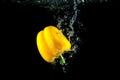 Yellow Pepper And Bright Water Splash. Healthy And Tasty Food On