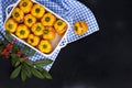 Yellow pepper stuffed with meat and rice in a pan for baking, on a black background and autumning branch for decoration. Free Royalty Free Stock Photo