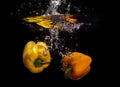 Yellow peppers in water Royalty Free Stock Photo