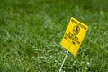 Yellow Pesticide Application Warning On Green Lawn Royalty Free Stock Photo