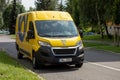 Yellow Peugeot Boxer van of Ceska posta Czech post office parked on a street of Havirov when delivering a package
