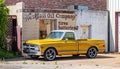 Yellow pickup car parked outdoors in a sunny spring day. USA Royalty Free Stock Photo