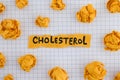 Yellow piece of paper with the word Cholesterol